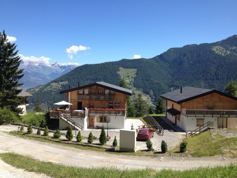The chalet in summer, overlooking the valley
